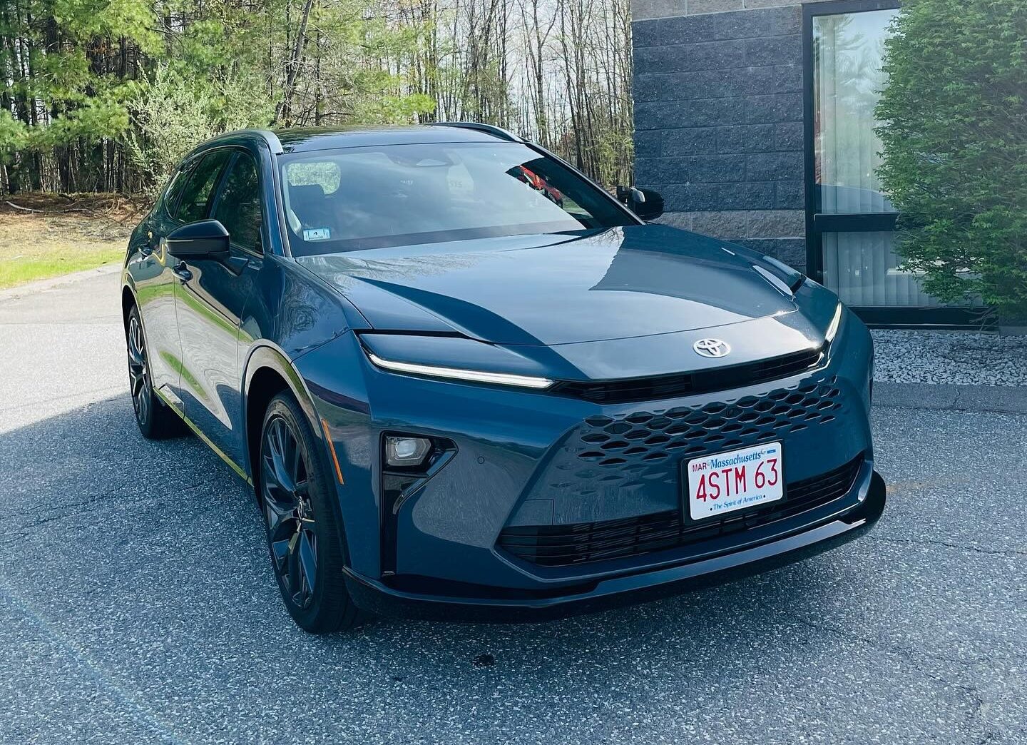 Dark blue daily-driven vehicle with a deep gloss finish, the kind of paint where chips and swirl marks show quickly
